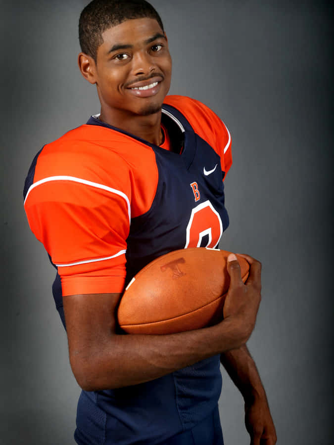 Smiling Football Player Portrait Wallpaper