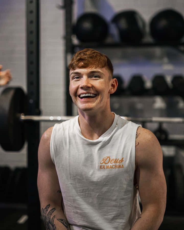 Smiling Man Gym Workout Wallpaper