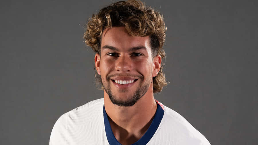 Smiling Soccer Player Portrait Wallpaper