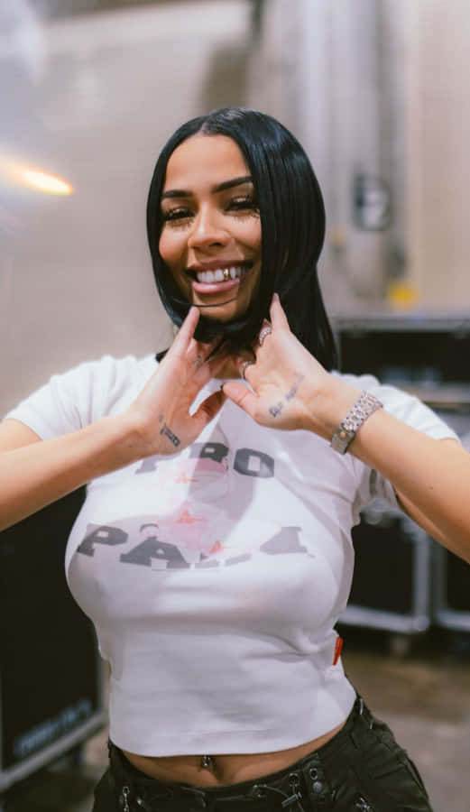 Smiling Woman Making Heart Sign With Hands Wallpaper