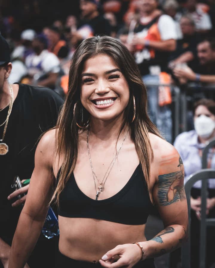 Smiling Womanat Sporting Event Wallpaper