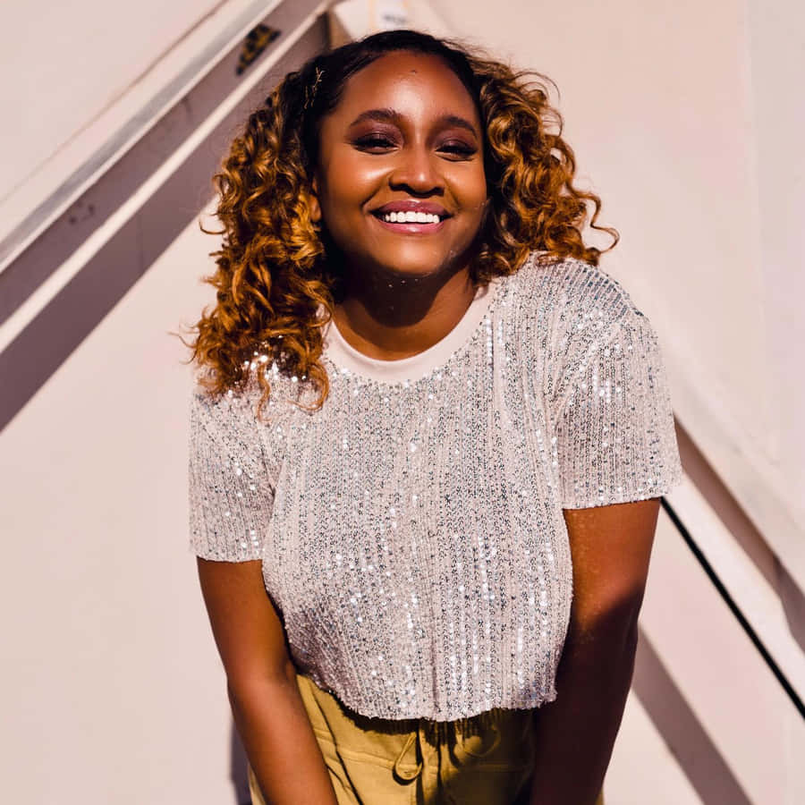 Smiling Womanin Silver Sequin Top Wallpaper