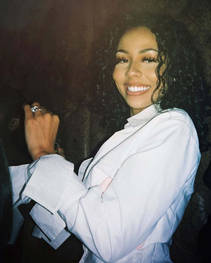 Smiling Womanin White Blouse Wallpaper