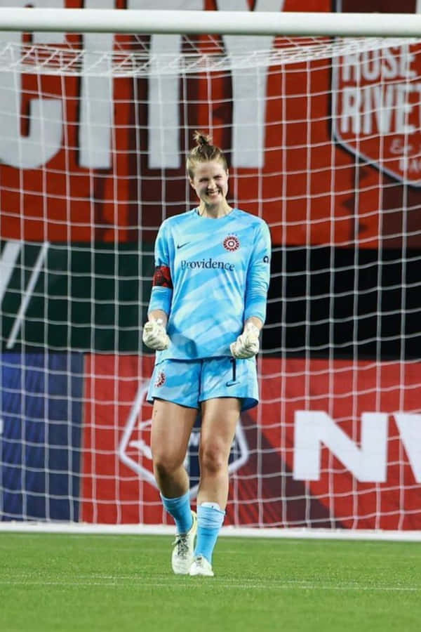 Soccer Goalkeeper Smilingon Field Wallpaper