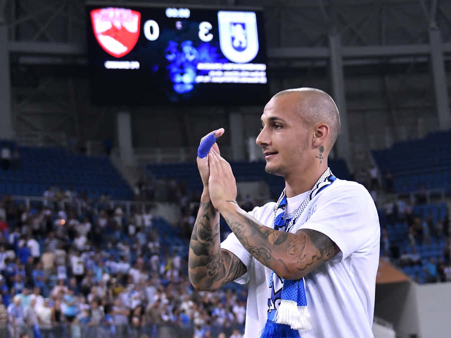 Soccer Player Applauding Crowd Stadium Wallpaper