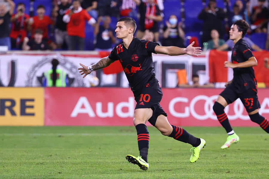 Soccer Player Celebrating Goal Wallpaper