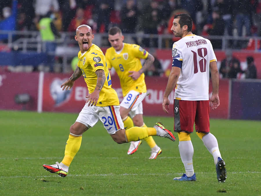 Soccer Player Celebrationin Rain Wallpaper