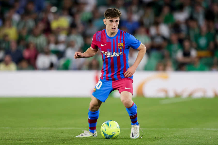 Soccer Player Controling Ball During Match Wallpaper