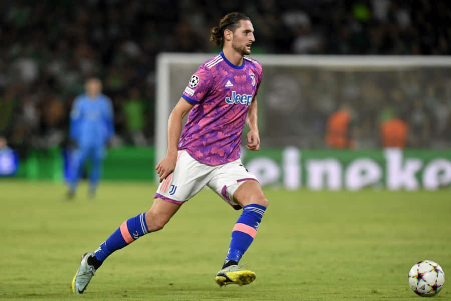 Soccer Player Dribblingin Match Wallpaper