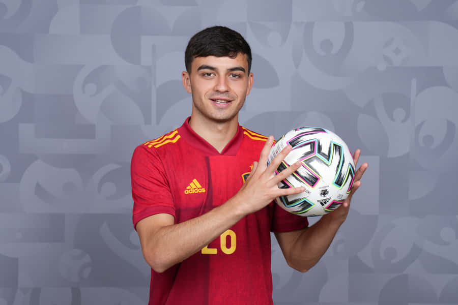 Soccer Player Holding Ball Spain Jersey Wallpaper