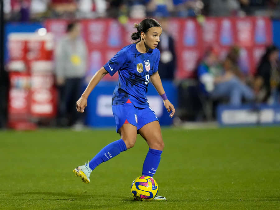 Soccer_ Player_in_ Action_on_ Field Wallpaper