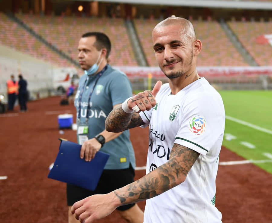 Soccer Player Thumbs Upat Stadium Wallpaper