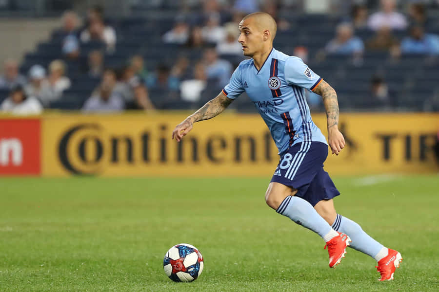 Soccer Playerin Action During Match Wallpaper