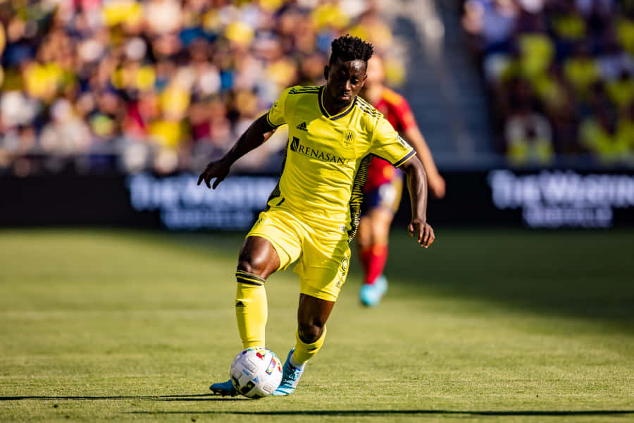 Soccer Playerin Action During Match Wallpaper