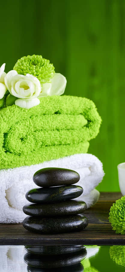 Spa Essentials Green Towelsand Stones Wallpaper