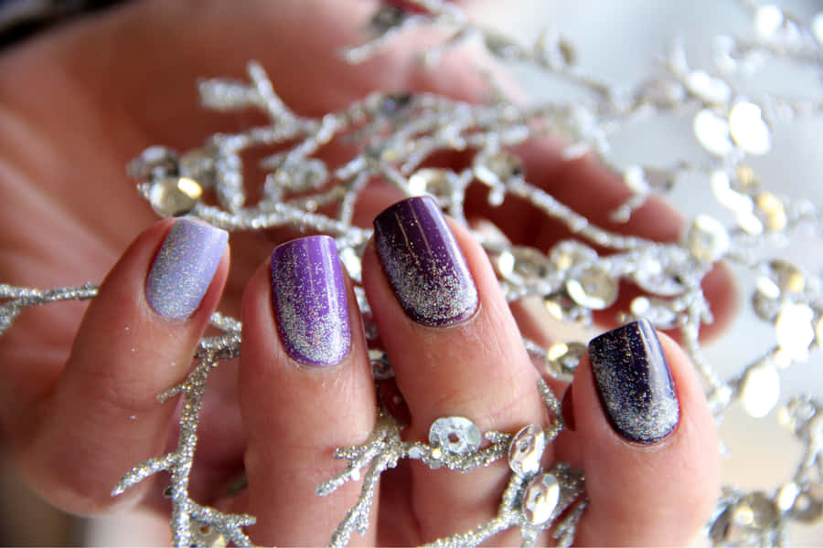 Sparkling Purple Manicurewith Silver Accessories Wallpaper
