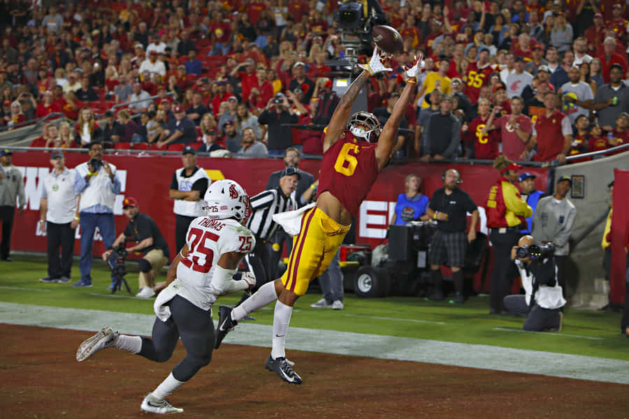 Spectacular_ Catch_ Football_ Game Wallpaper