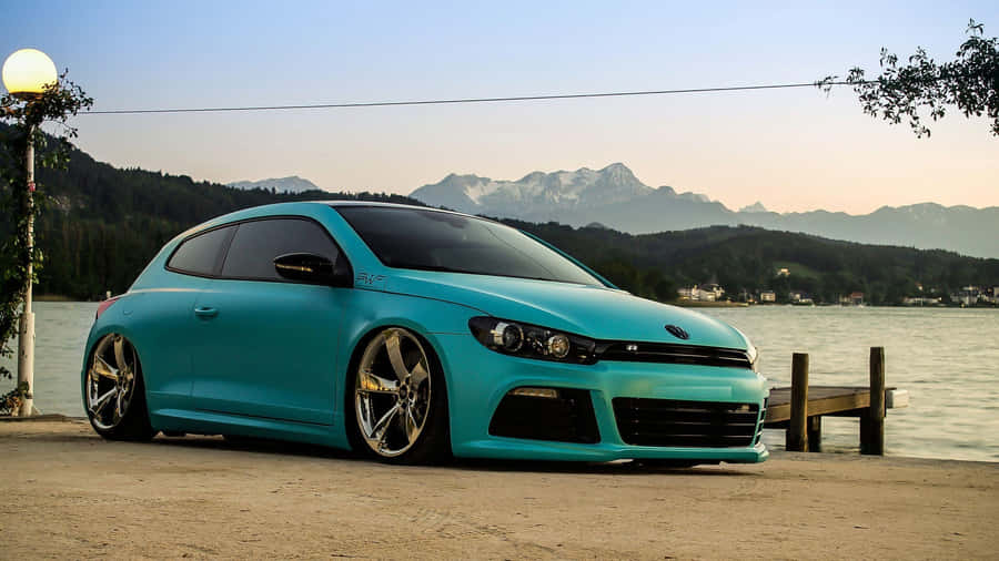 Sporty Yet Elegant: The Volkswagen Scirocco In Action Wallpaper