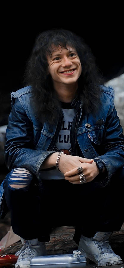 Squatting Eddie Munson Phone Wallpaper