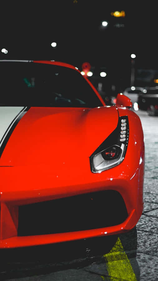 Stand Out From The Crowd With The Stylish Red Car Iphone Wallpaper