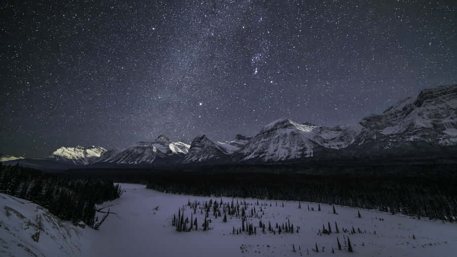 Starry_ Winter_ Night_ Mountain_ View_4 K.jpg Wallpaper