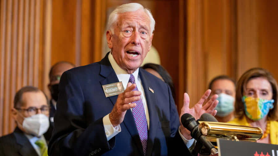 Steny Hoyer Delivering A Speech To An Engaged Audience Wallpaper