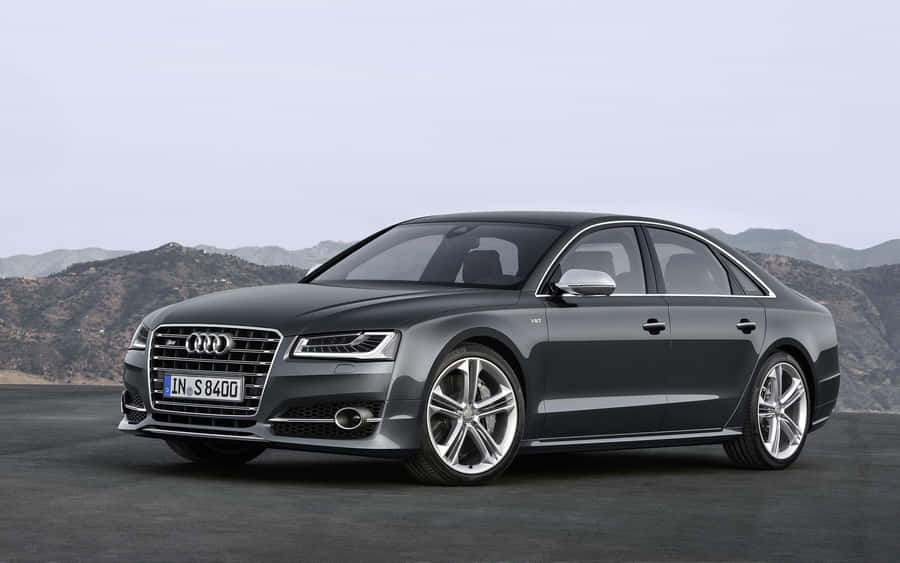 Striking Audi S8 Luxury Sports Sedan In Beautiful Landscape Wallpaper