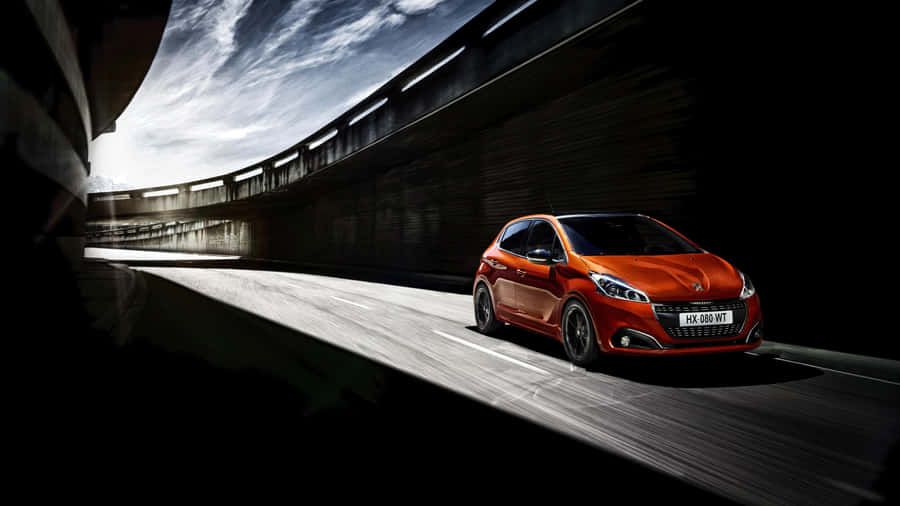 Striking Peugeot 208 On The Open Road Wallpaper