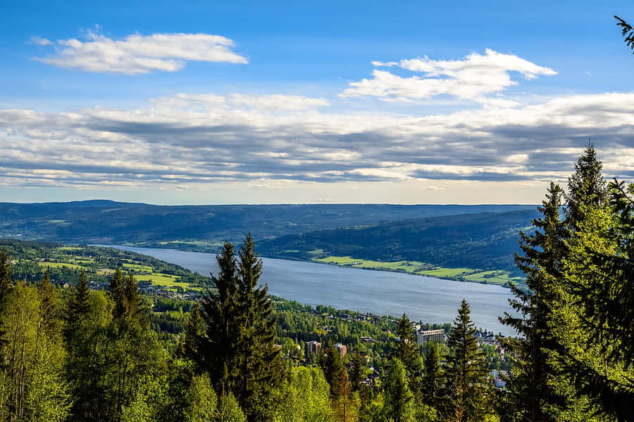 Striking Sunrise Over Snowy Lillehammer Wallpaper