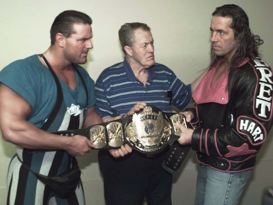 Stu Hart With His Sons Bret Hart And Davey Boy Smith: Legacy Of Wrestling Wallpaper