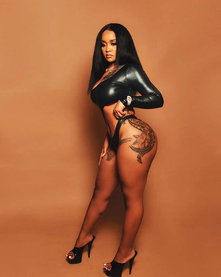 Stunna Girl Posingin Black Outfit Wallpaper