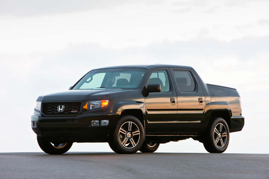 Stunning 2021 Honda Ridgeline Driving On A Scenic Road Wallpaper