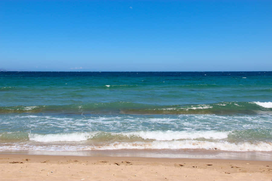 Stunning Beach Waves At Sunset Wallpaper