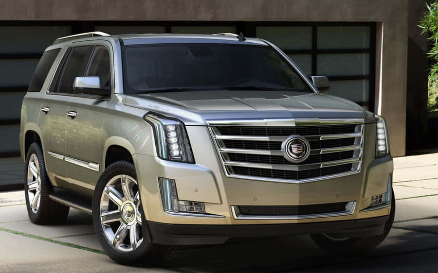 Stunning Cadillac Escalade Suv In Luxurious Setting Wallpaper