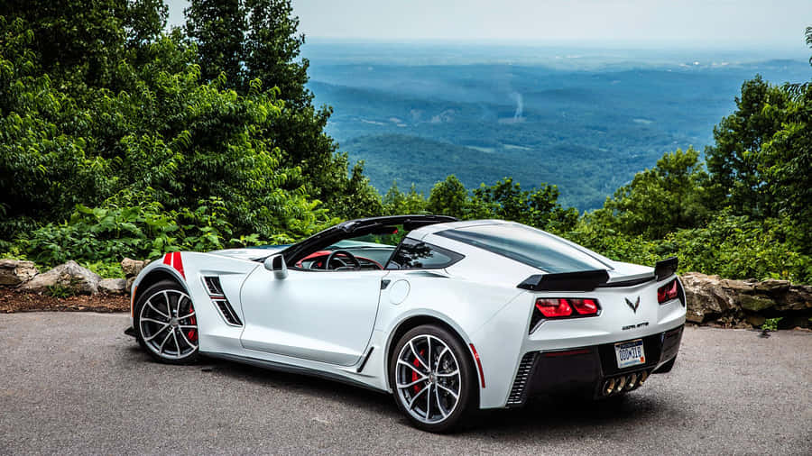 Stunning Chevrolet Corvette Grand Sport Cruising Down The Road Wallpaper