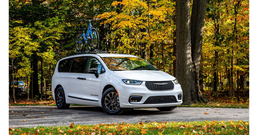 Stunning Chrysler Pacifica On A Scenic Road Wallpaper