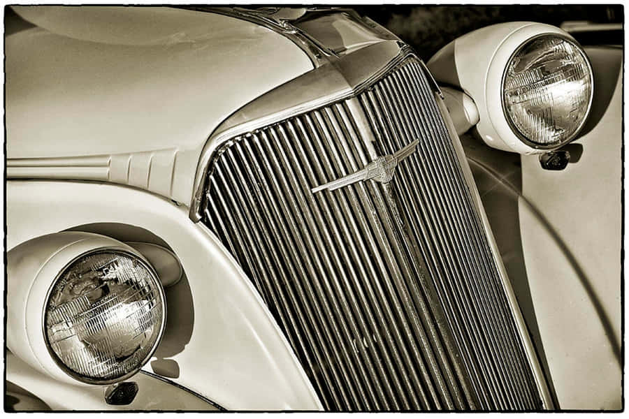 Stunning Close-up Of A Luxury Car Grill Wallpaper