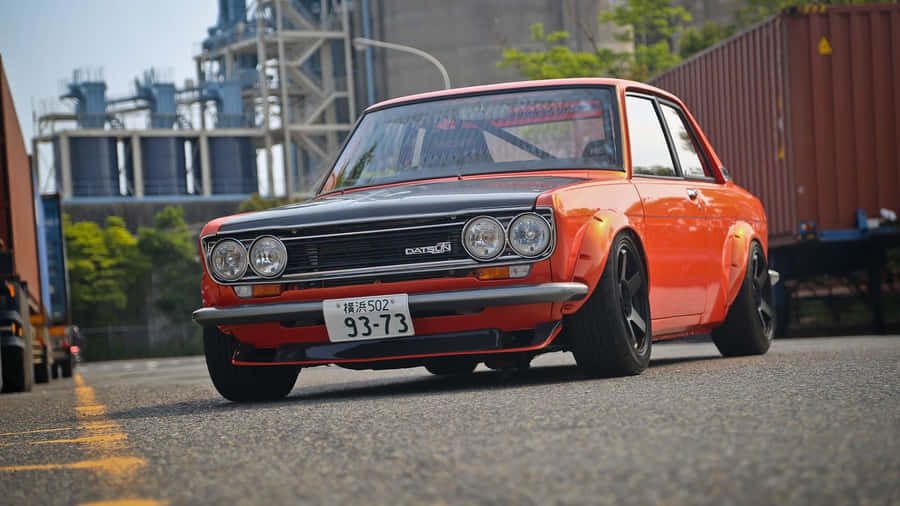 Stunning Datsun Car On The Road Wallpaper