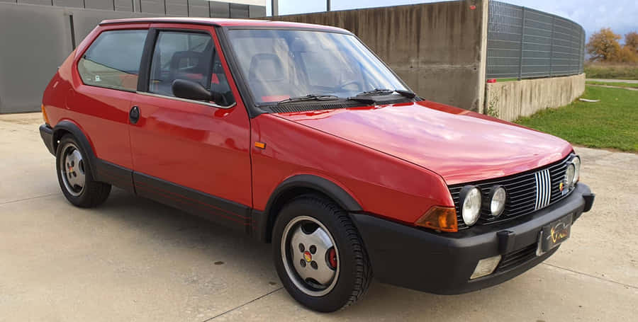 Stunning Fiat Ritmo On A Scenic Road Wallpaper