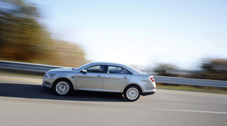 Stunning Ford Taurus In Motion Wallpaper