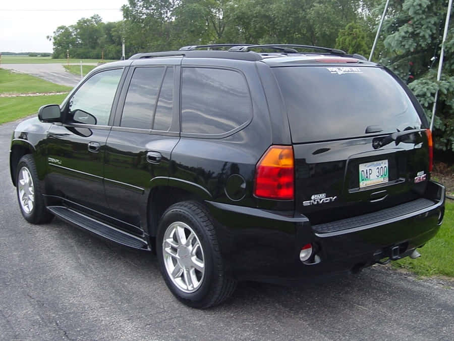 Stunning Gmc Envoy On The Road Wallpaper