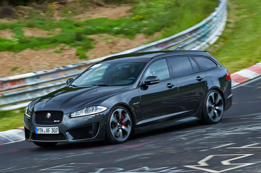 Stunning Jaguar Xfr Luxury Sports Sedan In Motion Wallpaper