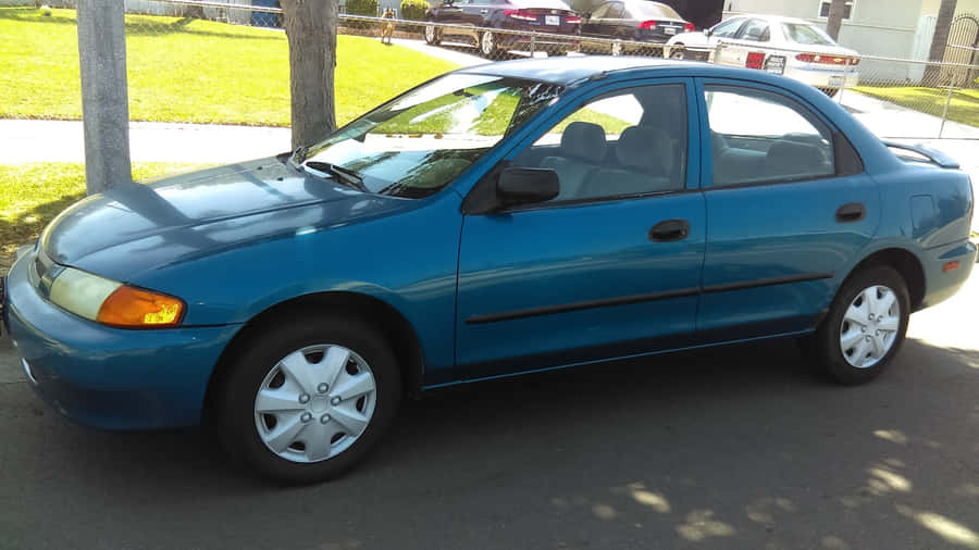 Stunning Mazda Protege Showcasing Its Powerful Design Wallpaper