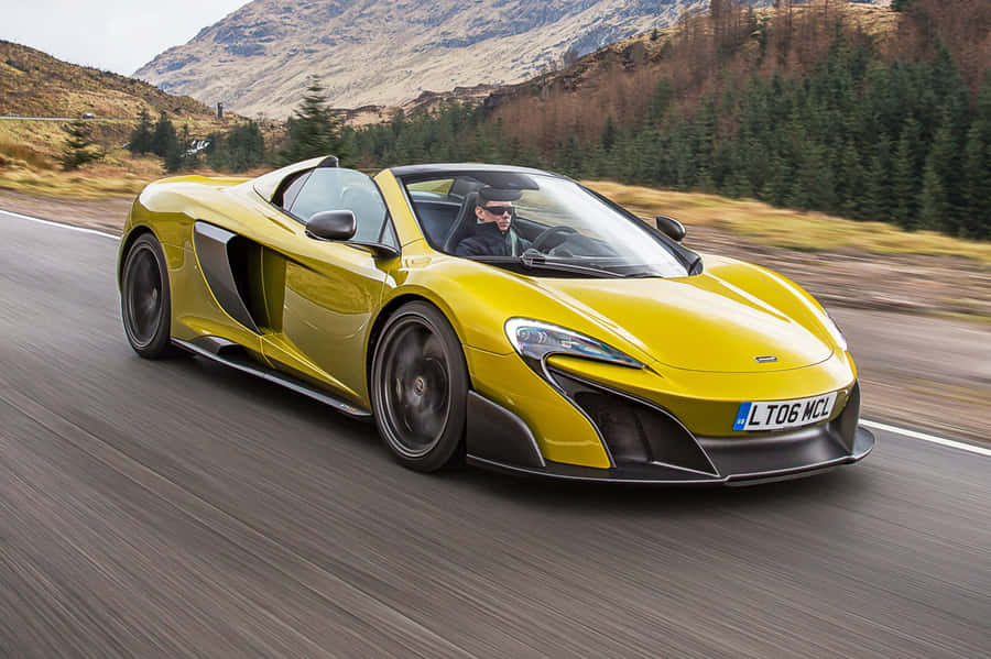 Stunning Mclaren 675lt Spider On The Open Road Wallpaper