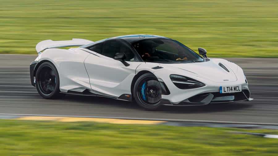 Stunning Mclaren 765lt Racing On The Track Wallpaper