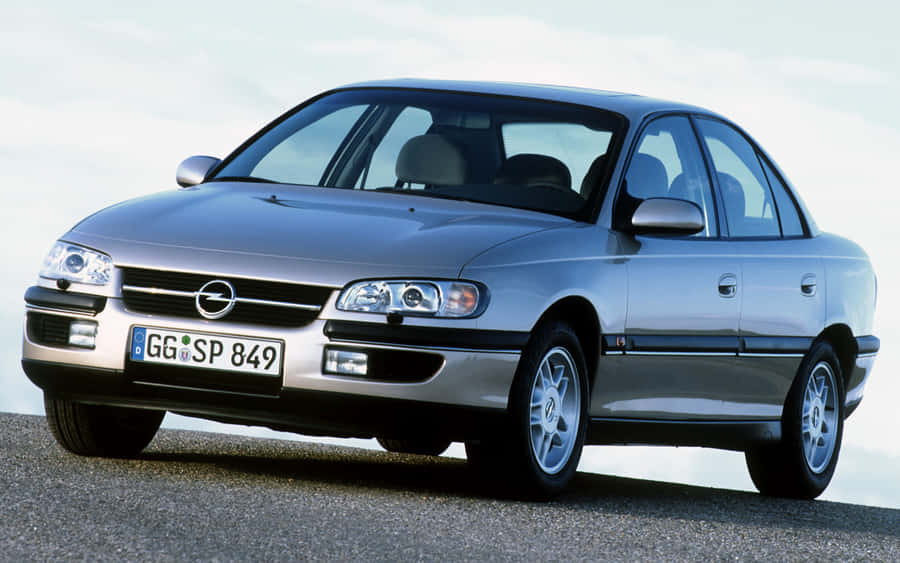 Stunning Opel Omega Cruising On The Open Road Wallpaper