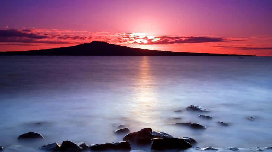 Stunning Purple Sunset Over The Horizon Wallpaper