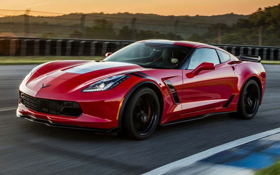 Stunning Red Chevrolet Corvette Grand Sport On The Road Wallpaper