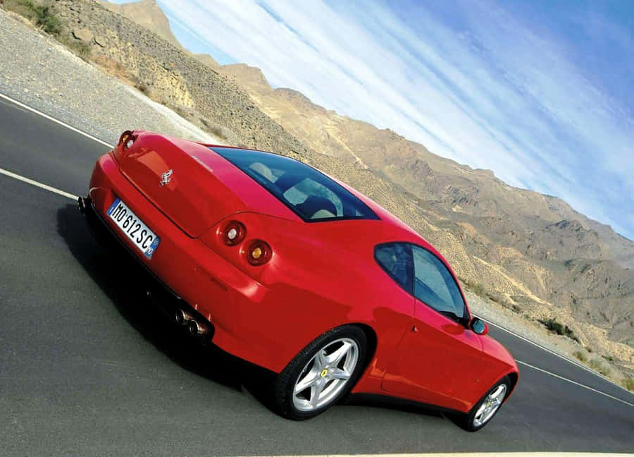 Stunning Red Ferrari 612 Scaglietti On Road Wallpaper