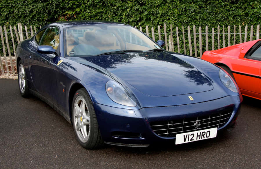 Stunning Red Ferrari 612 Scaglietti On The Open Road Wallpaper